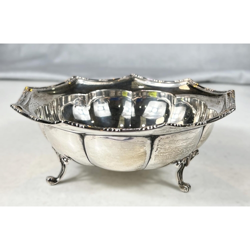 740 - A hallmarked silver bowl with lobed side on three feet, 4oz (marks worn)