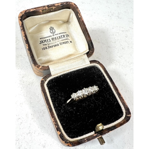 745 - An 18ct gold 5 stone diamond ring graduating sizes