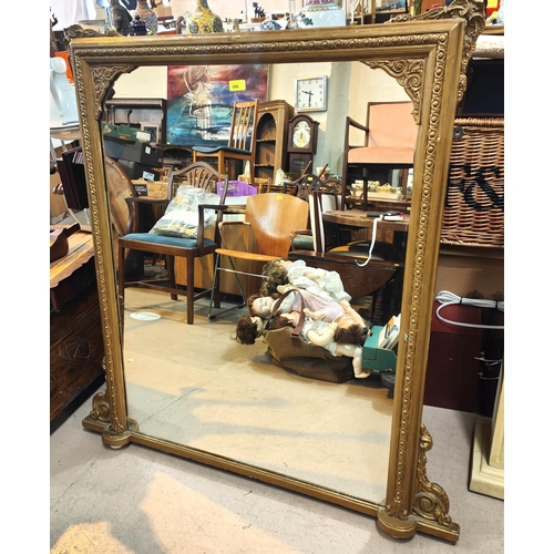 996 - A large late 19th/ early 20th century gilt framed overmantel mirror and a mahogany occasional table ... 