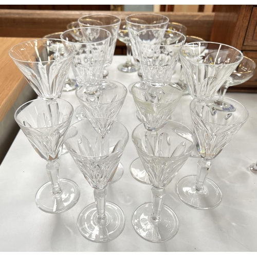 633 - A selection of slice cut Waterford glasses, Babycham and other similar glassware