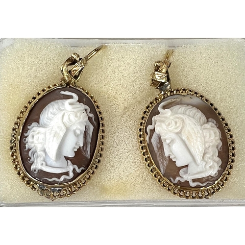 694 - A pair of female head cameo earrings; a Tara Dublin amber brooch