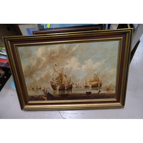 56A - A print of Ships framed in gilt and a street scene framed