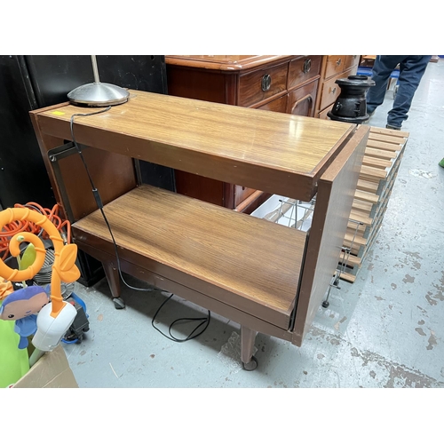 1001 - A mid 20th century teak coffee table; a vintage tea trolly with rotating shelves