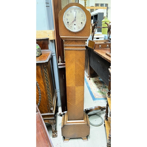 1009 - An oak cased Art Deco grand daughter clock, an oak carved case aneroid barometer