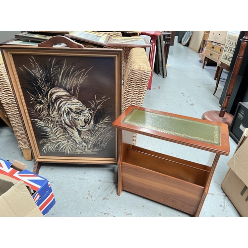 1010 - An oak framed tapestry fire screen depicting a prowling tiger and a reproduction occasional magazine... 