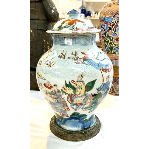 448 - A large Chinese covered Wucai baluster vase decorated with figures holding banners and a man on a ho...