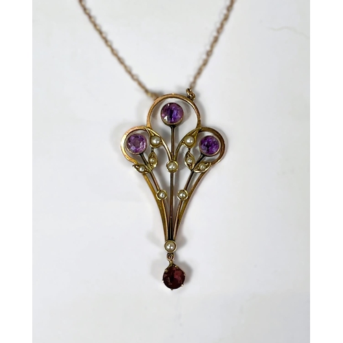 768 - An Edwardian 9ct gold pendant set with amethysts and seed pearls on fine chain stamped 