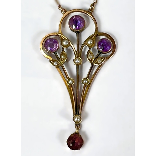 768 - An Edwardian 9ct gold pendant set with amethysts and seed pearls on fine chain stamped 