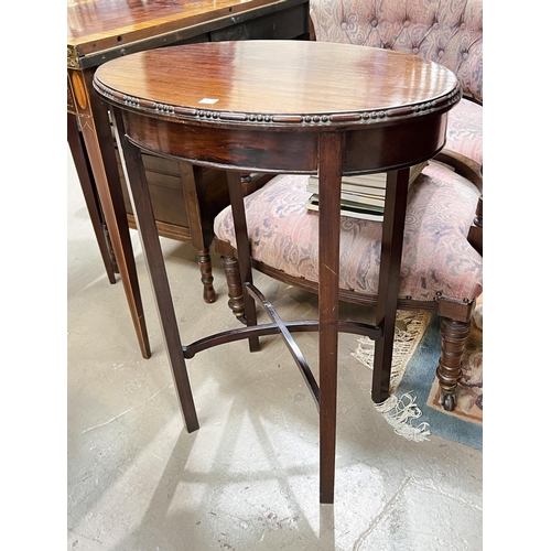 927 - An oval mahogany occasional table with beaded border; a dwarf mahogany sofa table