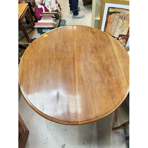 997 - A 19th century mahogany tilt top breakfast table with octagonal column and tripod base