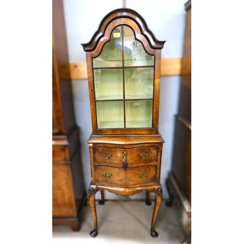 870 - A Burr Walnut  Queen Anne style display cabinet with glazed cupboard above and two drawers below.