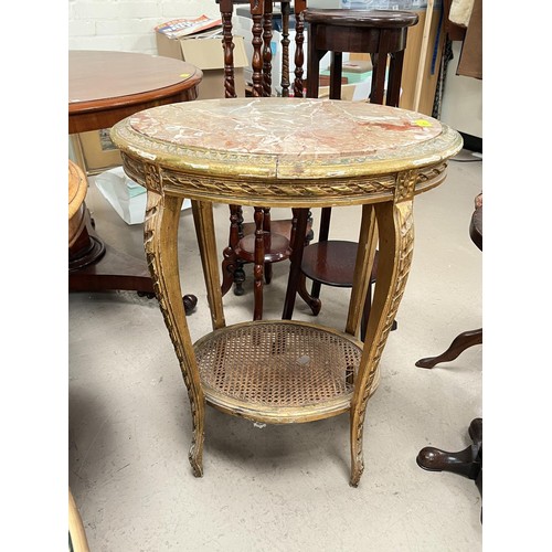 871 - A Louis XV marble top and gilt oval occasional table with shelf below.