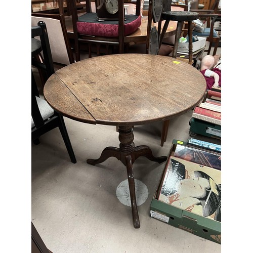 990 - An oak circular tilt top table on tripod base with column and a mahogany fall front desk top unit