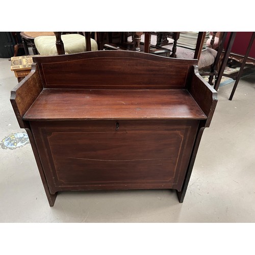 990 - An oak circular tilt top table on tripod base with column and a mahogany fall front desk top unit