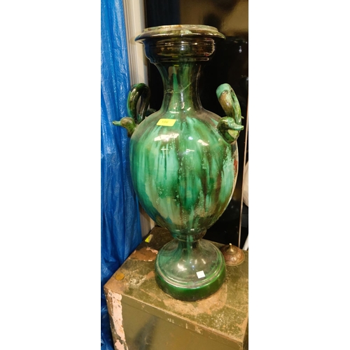 187 - A large Romanesque green drip glaze vase with snake type handles to each side (restored), a large co... 