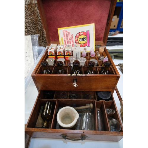 187A - A 19th century wooden apothecaries chest with later vintage glass medical bottles bottles, pestle an... 