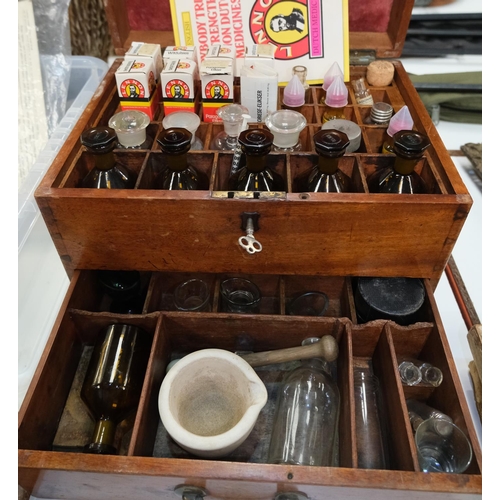 187A - A 19th century wooden apothecaries chest with later vintage glass medical bottles bottles, pestle an... 