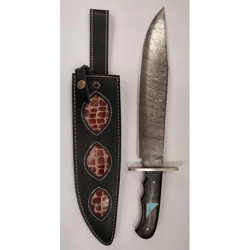 207 - A large Damascus bladed Bowie knife with composition handle, signed blade and leather sheath blade l... 