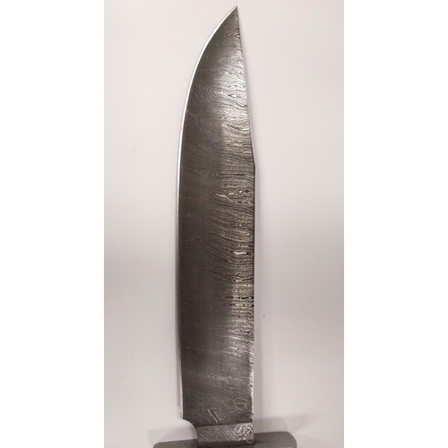 207 - A large Damascus bladed Bowie knife with composition handle, signed blade and leather sheath blade l... 