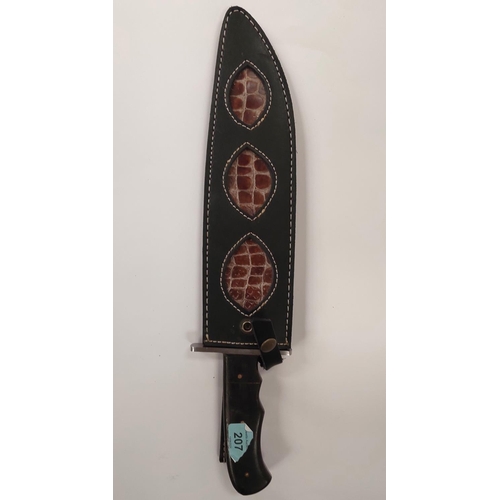 207 - A large Damascus bladed Bowie knife with composition handle, signed blade and leather sheath blade l... 