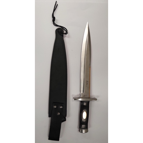 208 - A Hibben Knives Bowie knife steel blade with brass back edge, polished wooden handle, blade length 3... 