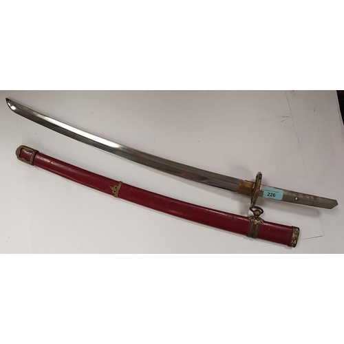 226 - A SAMURAI style sword with watered steel blade, the scabbard with red lacquer finish and metal mount... 