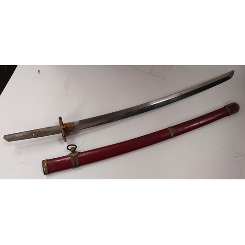 226 - A SAMURAI style sword with watered steel blade, the scabbard with red lacquer finish and metal mount... 