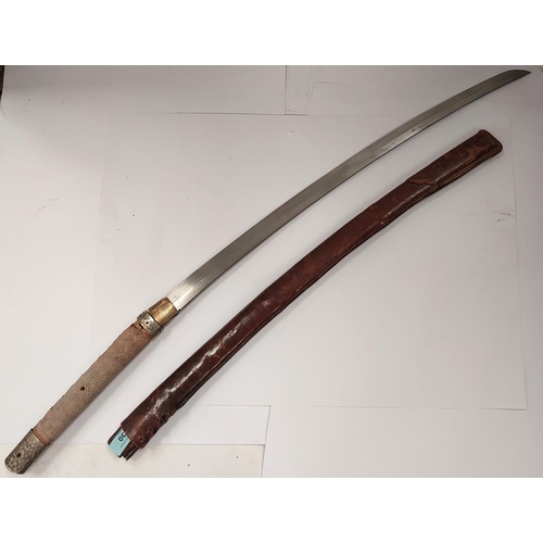 230 - A JAPANESE sword, the blade tang unmarked, with WWII style leather scabbard, the handle with fish sk... 