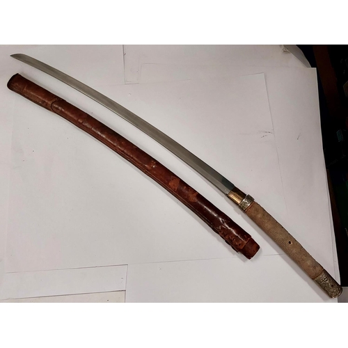 230 - A JAPANESE sword, the blade tang unmarked, with WWII style leather scabbard, the handle with fish sk... 