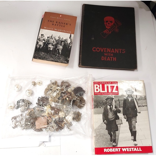 258 - A collection of military badges and buttons and three hardback books on military subjects