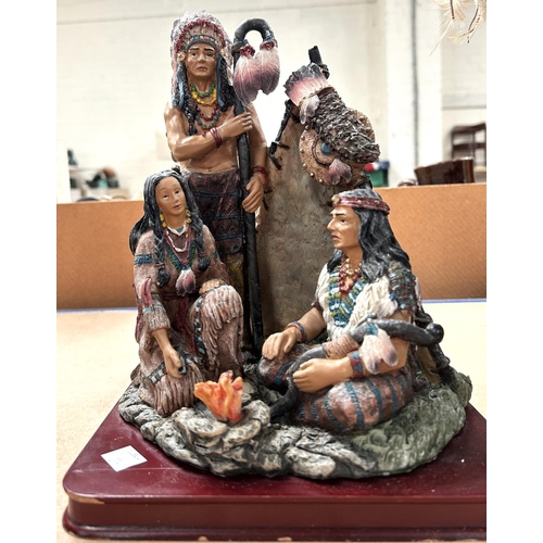 273 - Three modern resin figures of native americans and another depicting a native american scene 