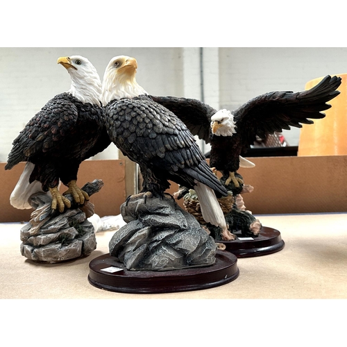 274 - Three resin figures of eagles including one with eaglets