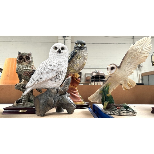 276 - Four modern resin owl figures 