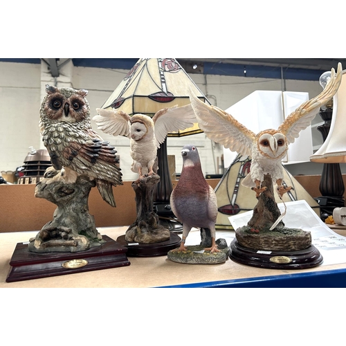 277 - Three modern resin owl figures and another of a pigeon 