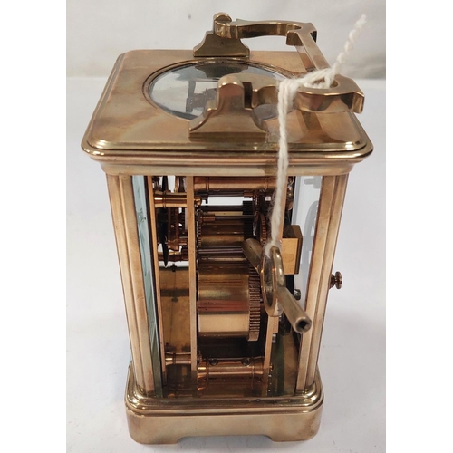 3 - A large brass carriage clock with enamel face, striking movement etc. (glass a.f)