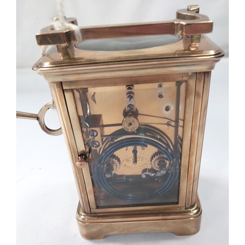 3 - A large brass carriage clock with enamel face, striking movement etc. (glass a.f)