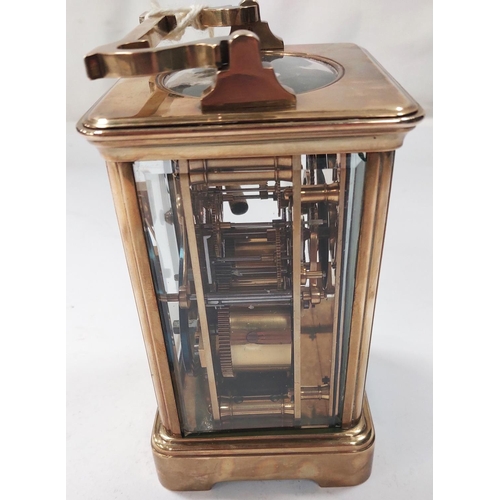 3 - A large brass carriage clock with enamel face, striking movement etc. (glass a.f)