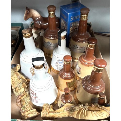 55 - A collection of modern Chinese figures etc, and Bell whiskey decanters etc (opened).