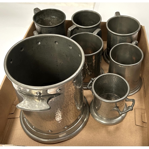 60 - A planished pewter siphon/bottle stand and 6 small pewter tankards, 3 with glass bottoms.