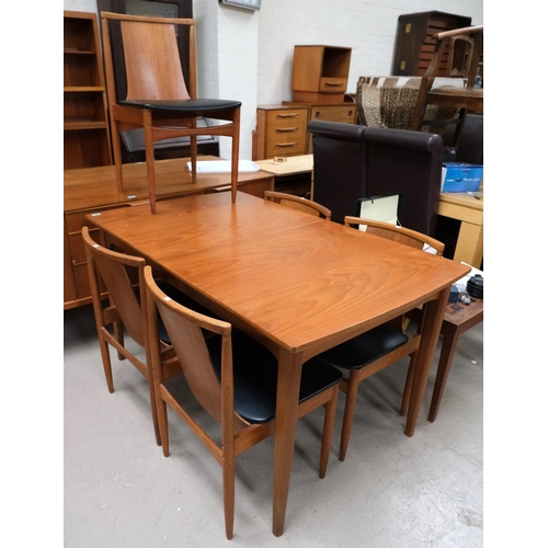 862 - A mid 20th Century rounded rectangular extending G-Plan table with 5 matching solid back teak dining... 