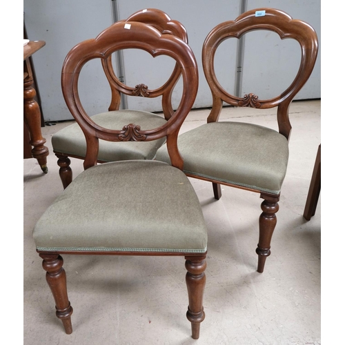 864 - A set of four 19th Century mahogany balloon back dining chairs with turned legs.