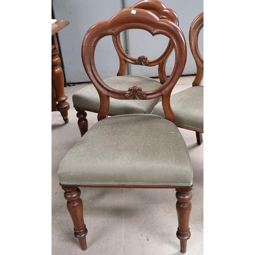 864 - A set of four 19th Century mahogany balloon back dining chairs with turned legs.