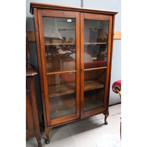 883 - A mahogany two door display cabinet on cabriole legs.