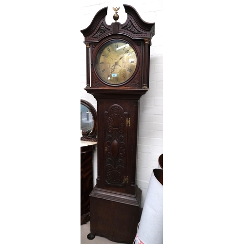 904 - A late 18th Century/early 19th Century carved oak longcase clock with swan neck pediment, ball finia... 