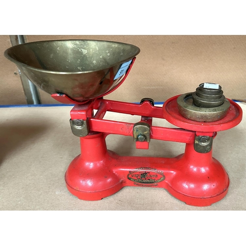 91 - A set of brass kitchen scales and weights; a jam pan and metal ware.