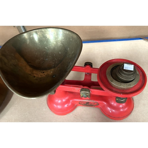 91 - A set of brass kitchen scales and weights; a jam pan and metal ware.