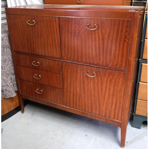 930 - A mid 20th Century teak cabinet with cocktail section, writing section, fall front, three drawers be... 