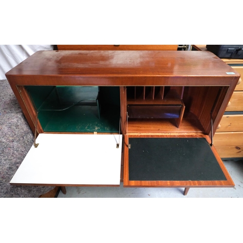 930 - A mid 20th Century teak cabinet with cocktail section, writing section, fall front, three drawers be... 