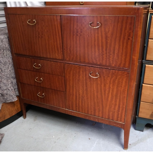 930 - A mid 20th Century teak cabinet with cocktail section, writing section, fall front, three drawers be... 