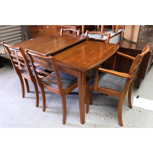 932 - A Bartlett High Wycombe Strongbow extending dining table and chairs.